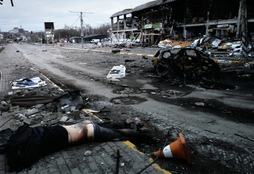 Donbas Frontliner / The corpse of an unidentified man in civilian clothes lies prone on a street leading to Bucha