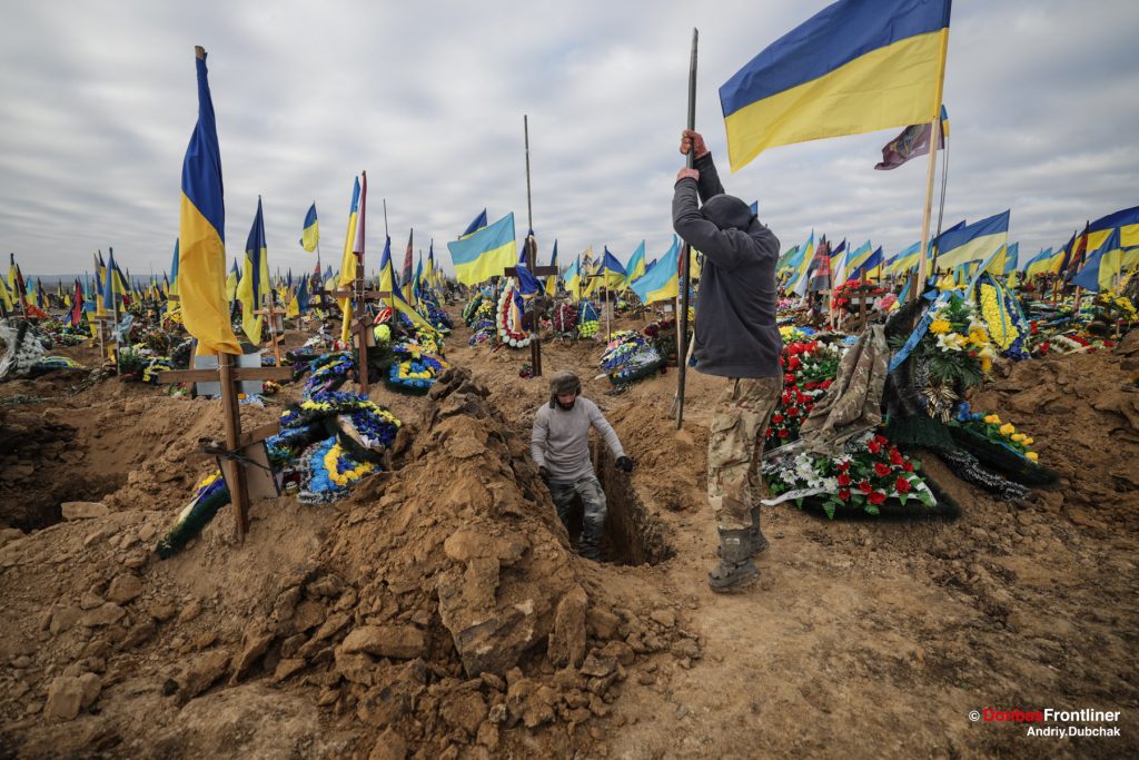Ukraine war, donbas frontliner, Andriy Dubchak, cemetry, pre-dig new grave, killed Ukrainian soldiers, flag