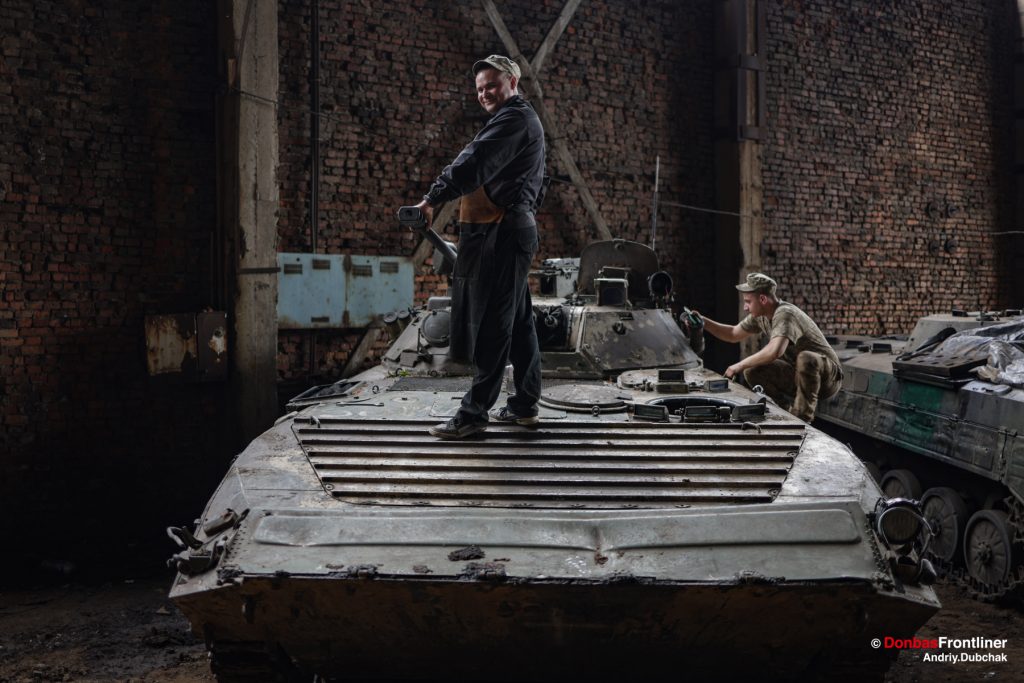Ukrainian mechanic repair military vehicle BMP1
