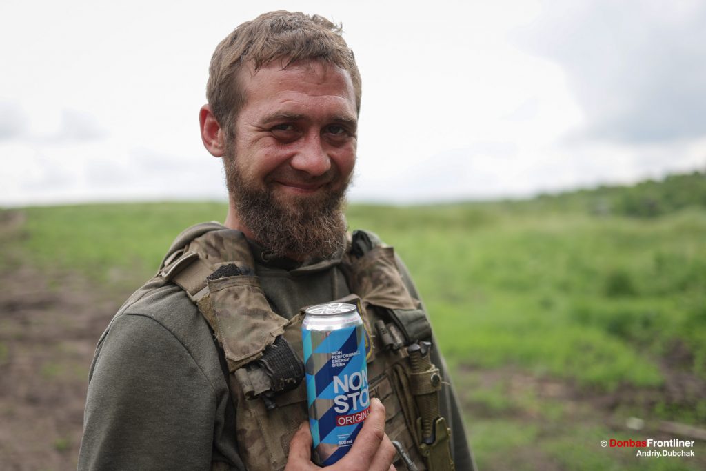 Donbas Frontliner, Ukraine war, artillery grad Partizan, Aidar battalion, call-sign Grek with non stop drink. The Guerrilla Grad's operational activity and combat missions run without stopping if necessary. Artek
drinks a Non Stop Energy Drink and makes a joke about this.