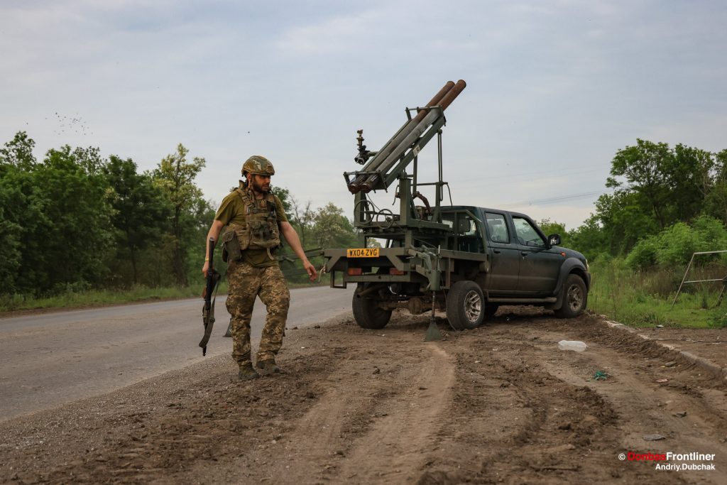 Donbas Frontliner, Ukraine war, artillery grad Partizan, Aidar battalion, soldiers setup the bus near homemade Grad MLRS and ready to fire to russian position, Andriy Dubchak, Veselyi makes the final preparations, and then everyone takes cover and waits for the commander to
give the order over the radio.