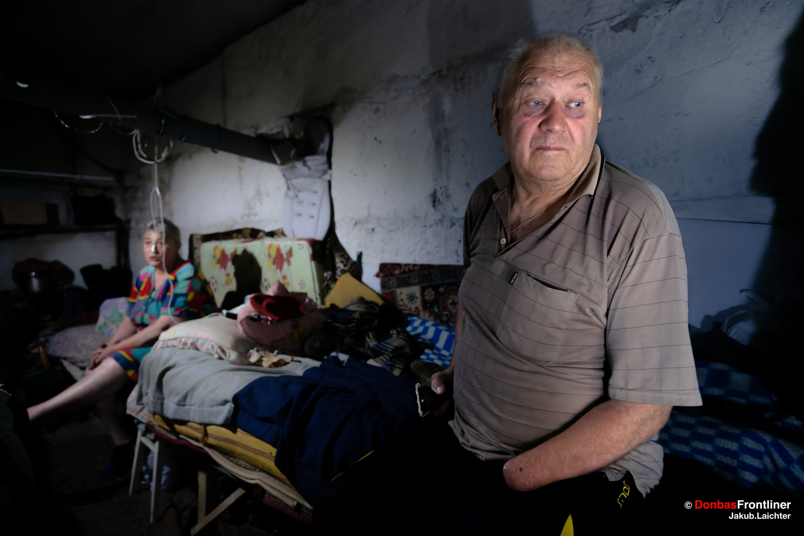 Donbas Frontliner . Valerii, 63, sits in a cellar sheltering from shelling with his wife Jevhdakia.